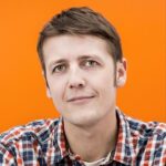 Profile picture from Michael. Brown short hair, with plaid shirt.